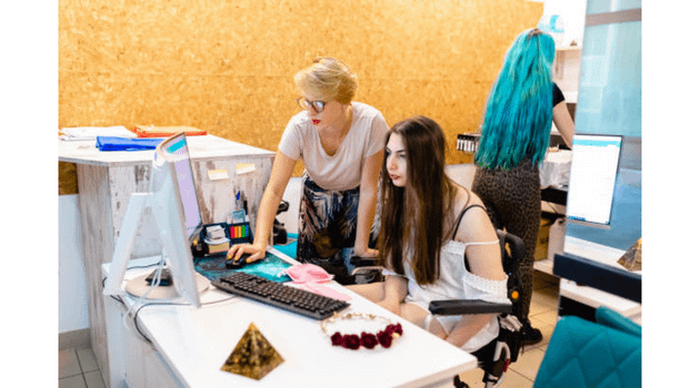 two-white-women-checking-desktop