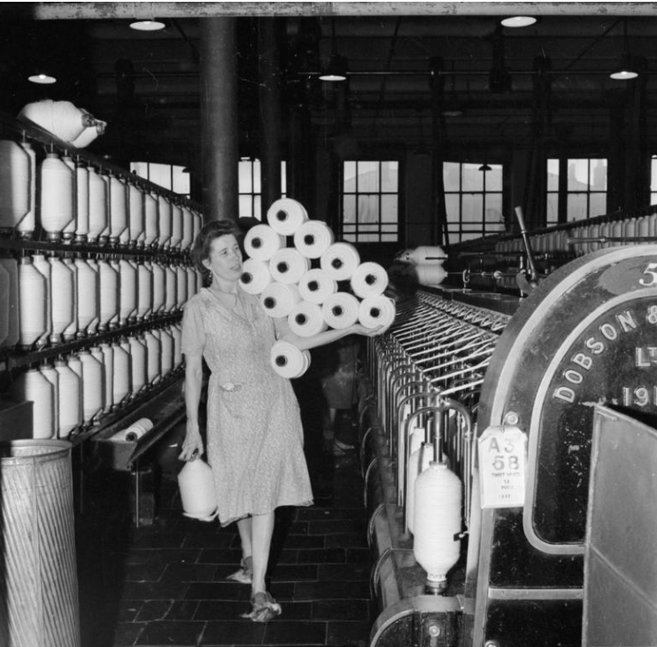 lady carrying yarn for fabric manufacturer
